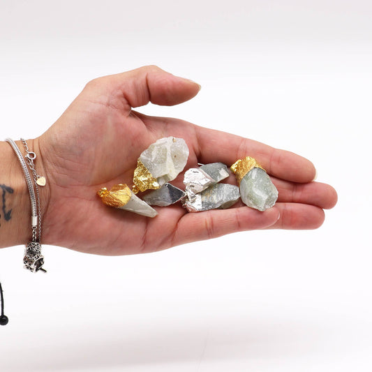 Assorted green Indian Jade gemstone pendants with decorative gold and silver plated settings.