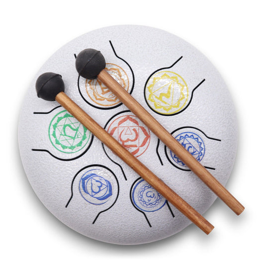 White 18cm steel tongue drum featuring colourful etched symbols representing the seven chakras.