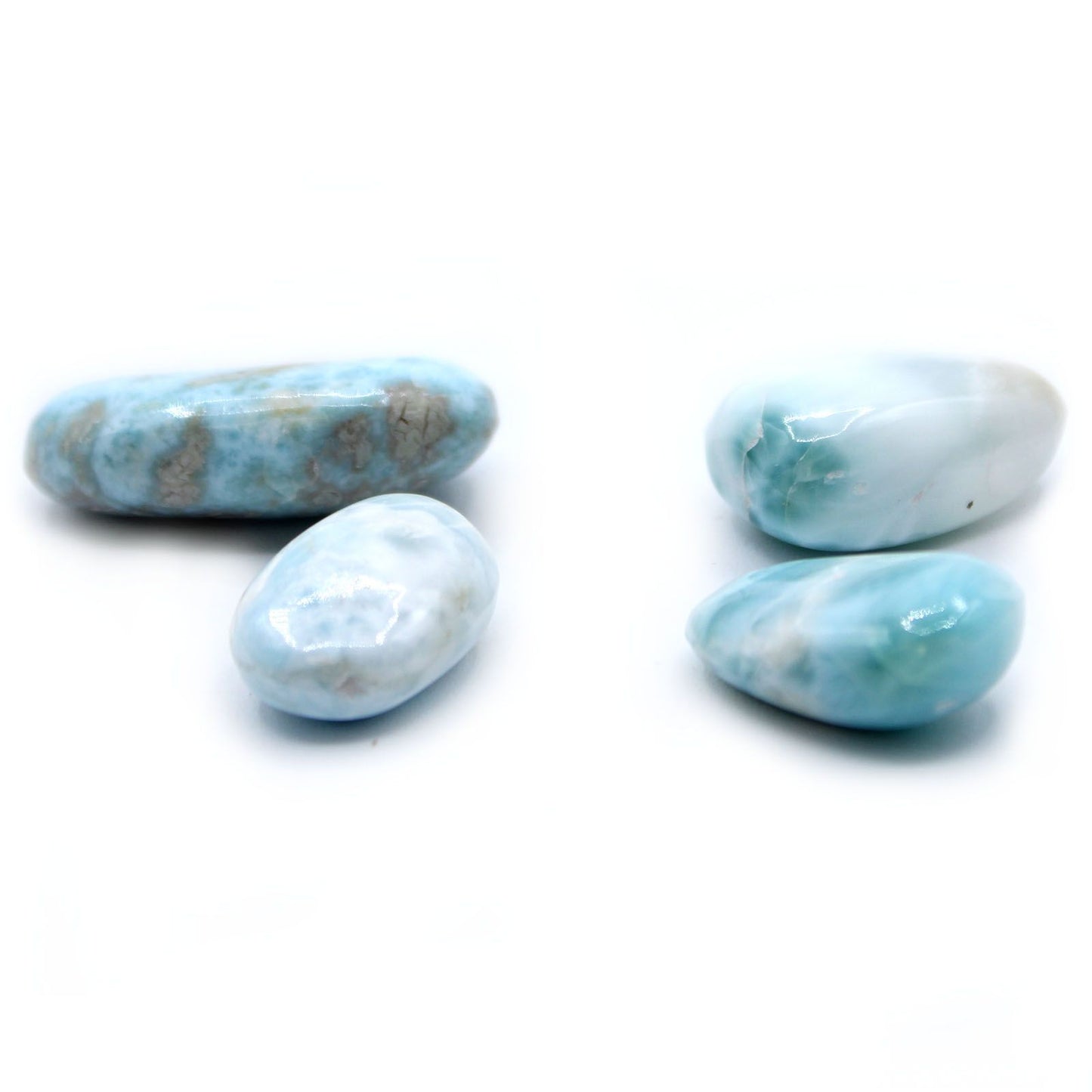 A smooth, polished Larimar tumble stone showcasing beautiful sky blue and white marbled patterns.
