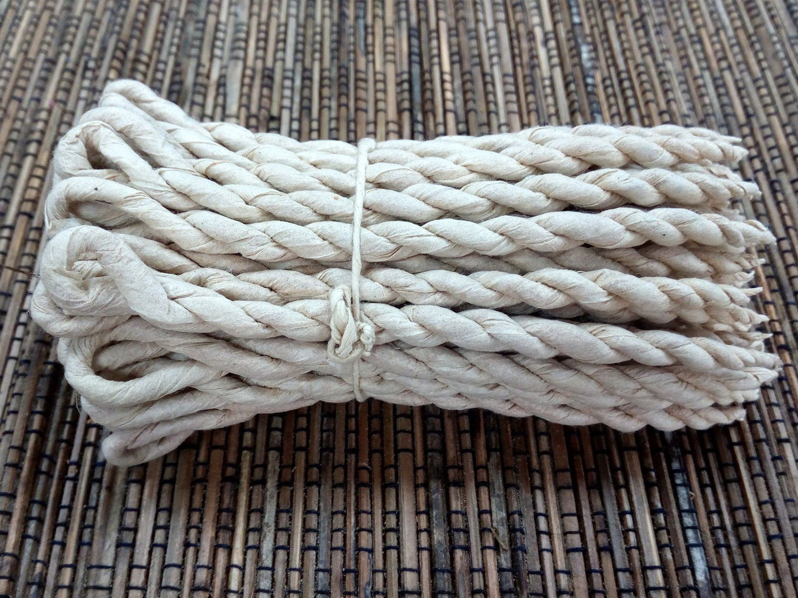 Handcrafted bundle of traditional herbal rope incense made from spikenard and sandalwood.