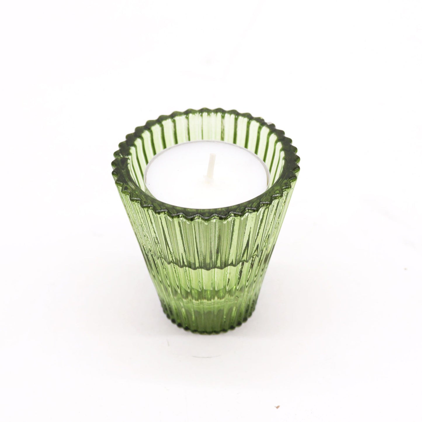 Translucent garden jade green glass candle holder with a versatile reversible design for dinner candles and tea lights.