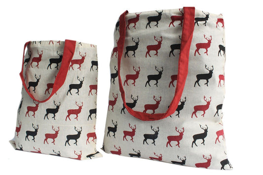 Large reversible tote bag in a deep wine colour featuring a hand-stamped white stag block print design.