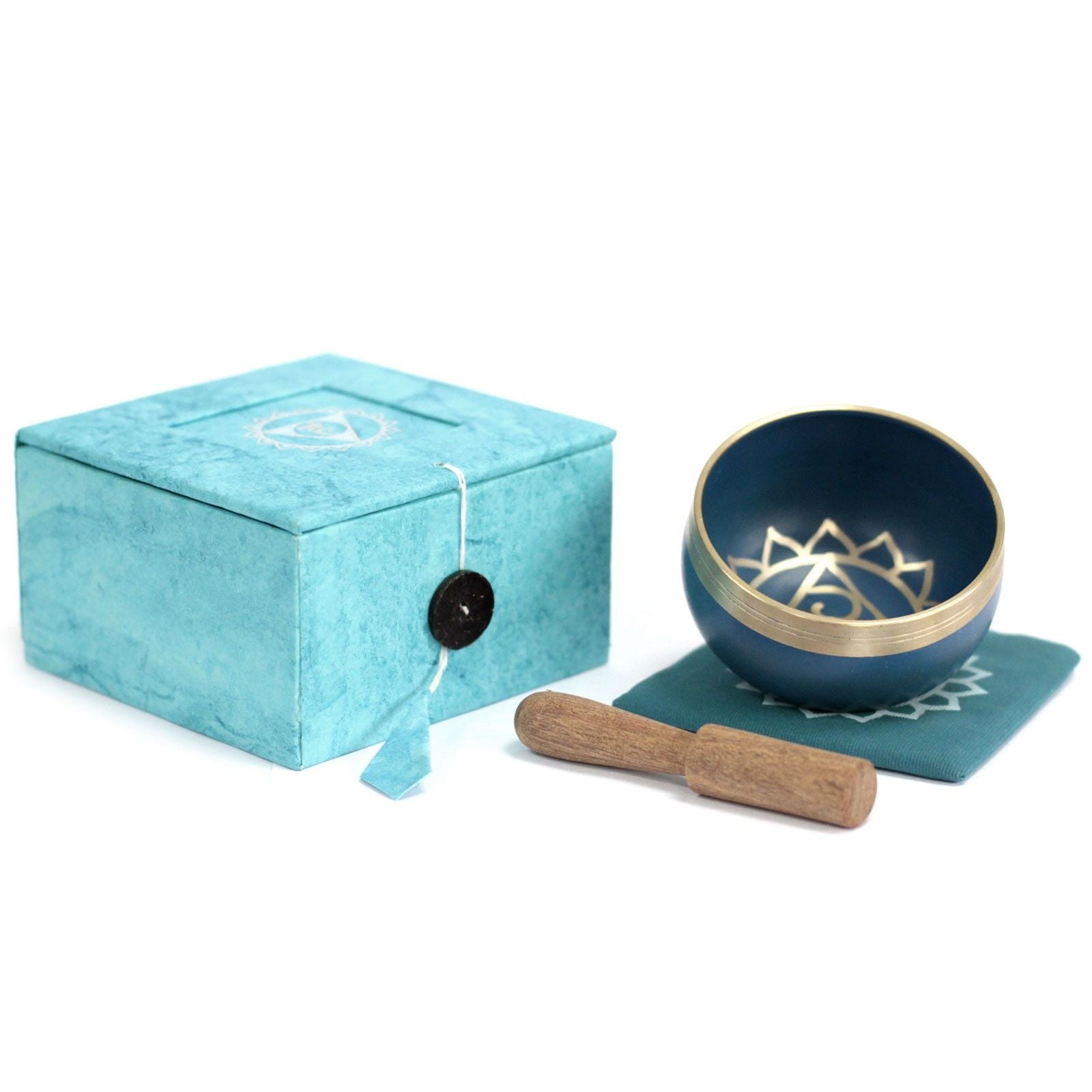 Bright blue handcrafted Tibetan style singing bowl for throat chakra meditation and sound healing therapy.