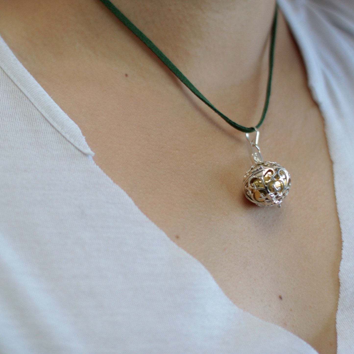 Intricately designed 23mm sterling silver angel bell pendant with a polished finish and ornate detailing.