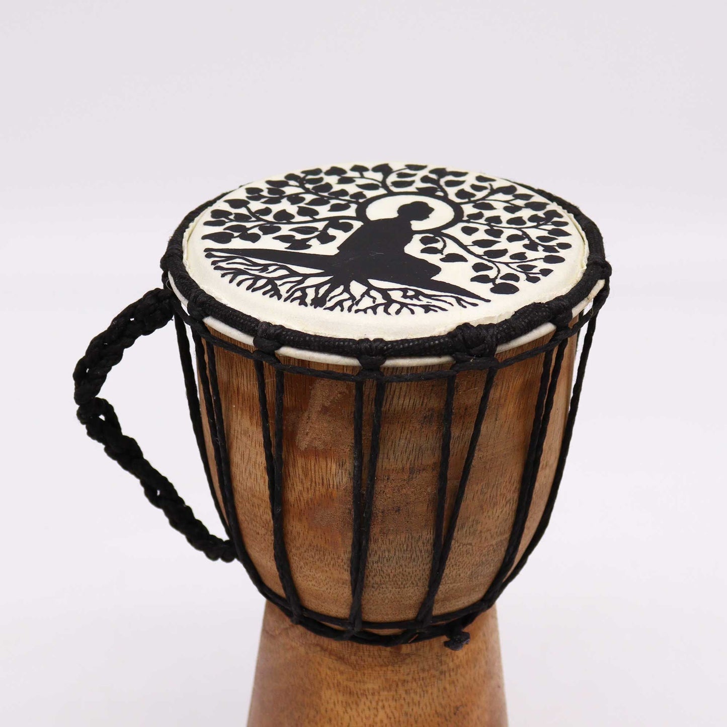 Handcrafted wooden djembe drum with a wide top featuring a detailed Buddha design on the drum skin.