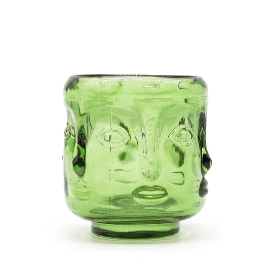 Serene green glass candle jar featuring embossed Buddha faces in a calming garden jade finish.