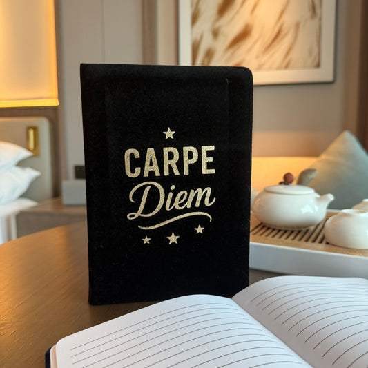 Elegant black velvet notebook with silver Carpe Diem text on the cover, featuring 80 lined pages for journaling.