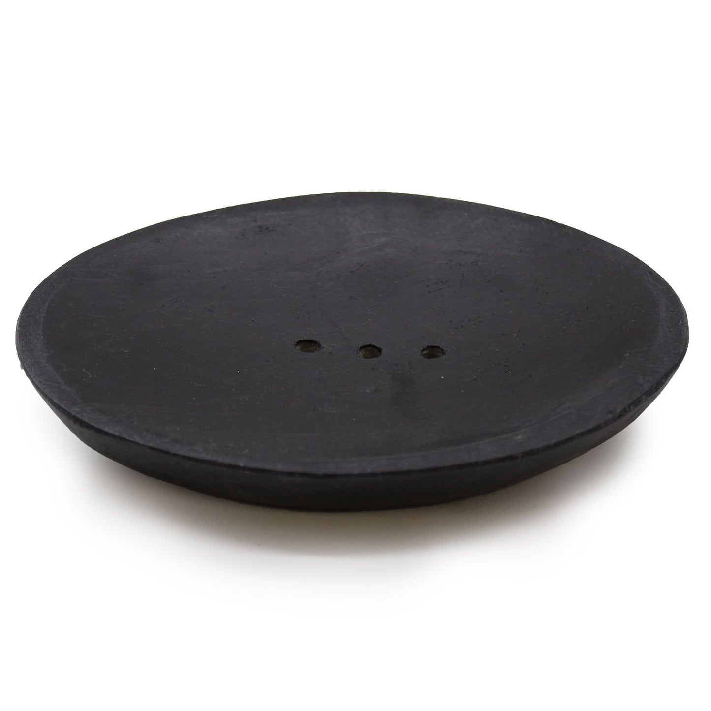 Elegant oval soap dish crafted from polished black marble with drainage holes on a minimalist background.