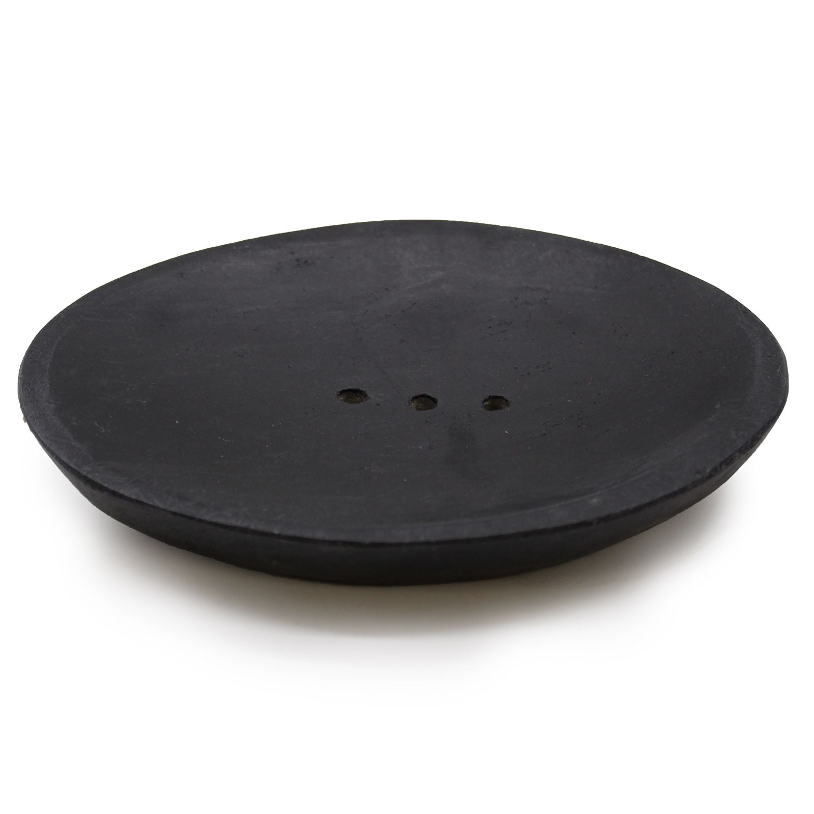 Elegant oval soap dish crafted from polished black marble with drainage holes on a minimalist background.