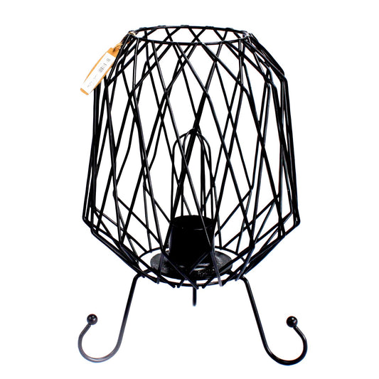 Industrial black mesh iron basket lamp filled with natural pink Himalayan salt rocks, glowing with warm ambient light.