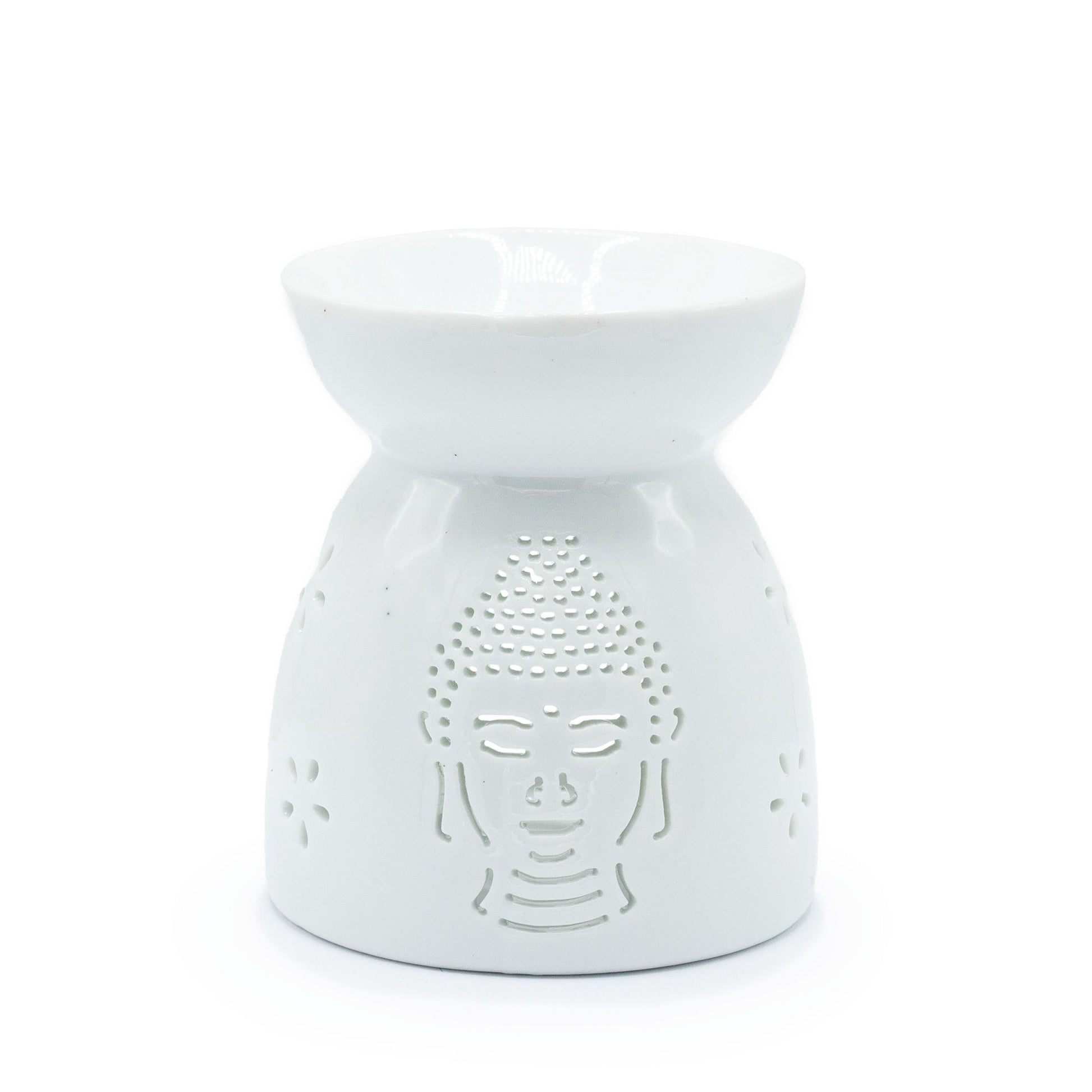 Elegant white ceramic oil burner featuring a serene Buddha face silhouette with decorative cut-out details.