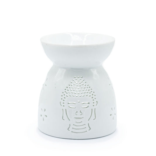 Elegant white ceramic oil burner featuring a serene Buddha face silhouette with decorative cut-out details.