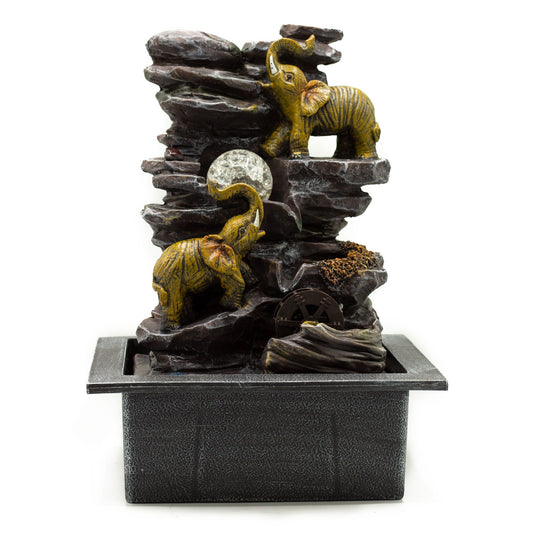 Detailed grey polyresin tabletop water feature with three elephants, a spinning crystal ball, and a moving water wheel.