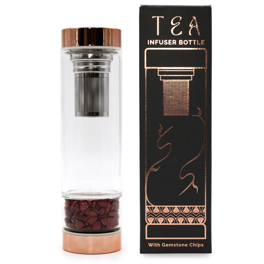 Crystal glass tea infuser bottle with rose gold caps and vibrant Red Jasper gemstones in a bottom chamber.
