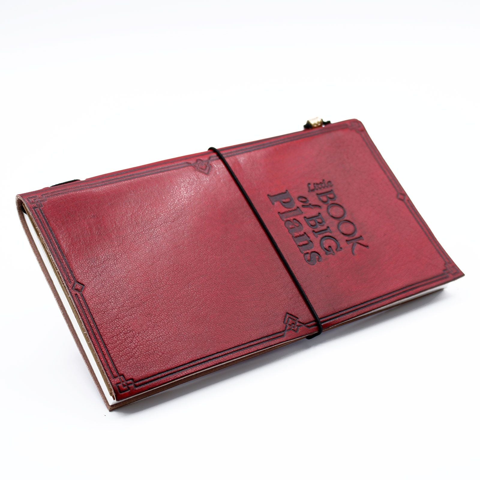 Slim red handmade leather journal featuring an embossed quote and a wrap-around leather tie closure.