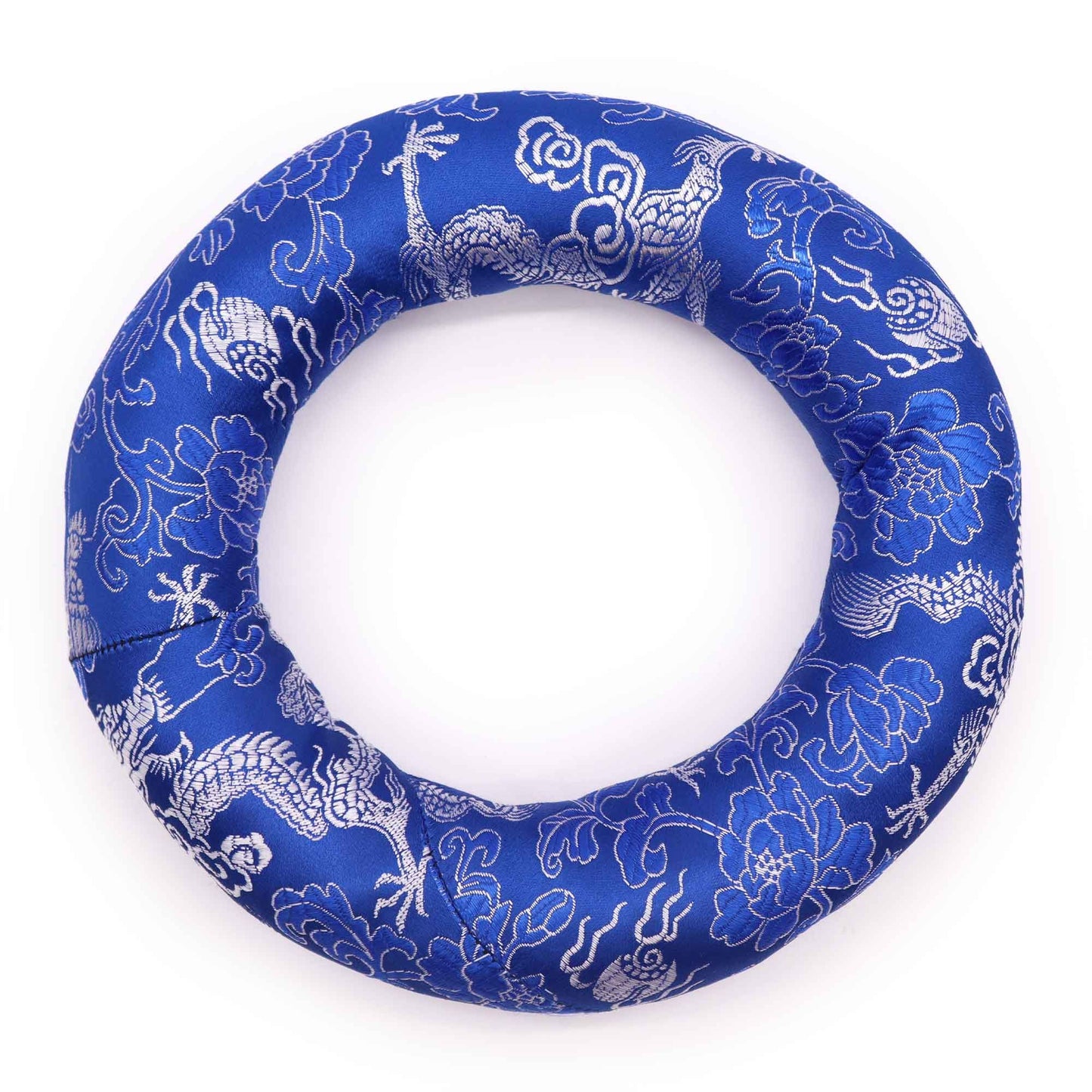 A colourful circular fabric hoop cushion designed to support a Tibetan singing bowl.