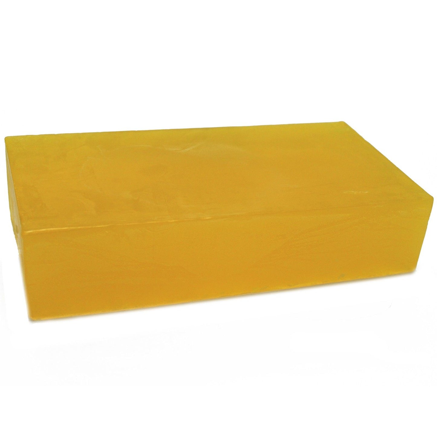 Large rectangular handmade soap loaf with a vibrant yellow colour and textured top, infused with lemon essential oil.