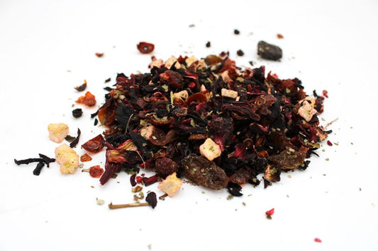 Vibrant red loose leaf artisan tea blend featuring dried blackberries, raspberries, and strawberries in a 1kg bag.