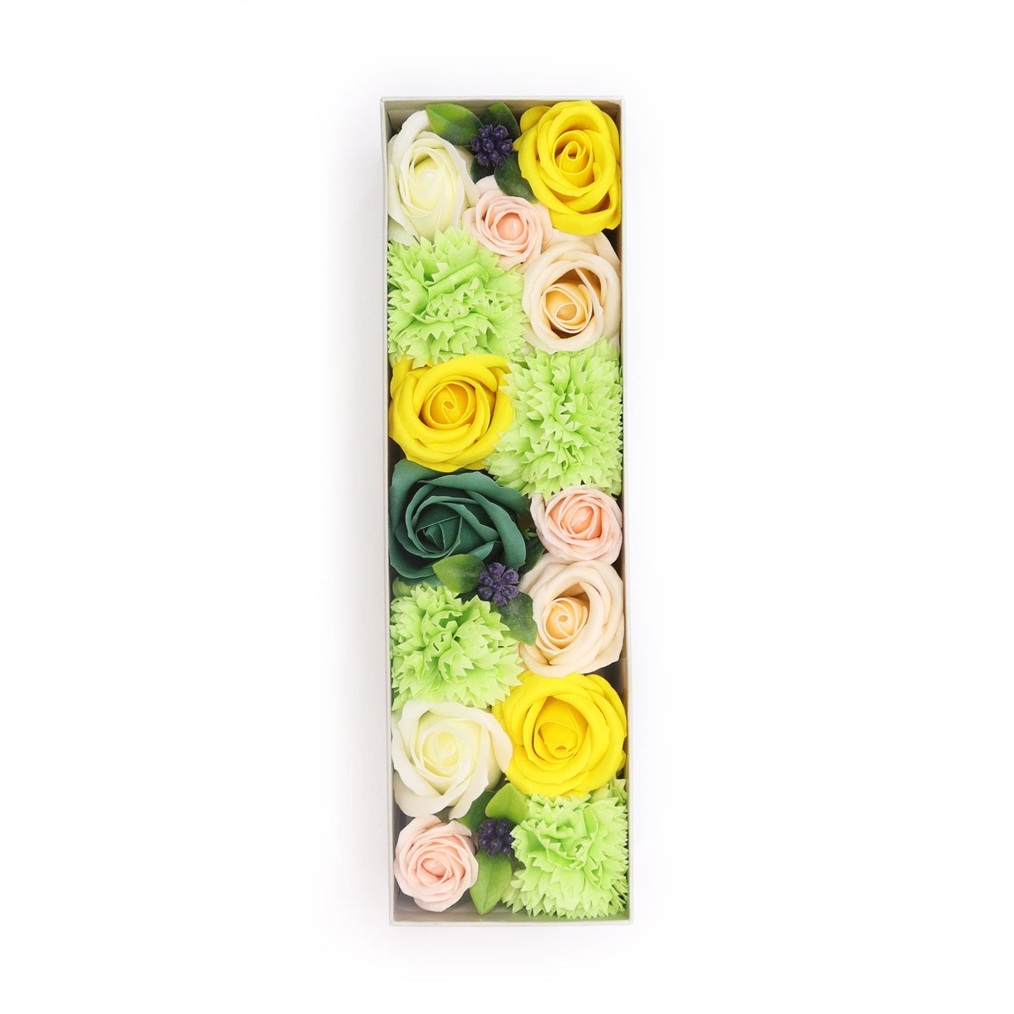 A long gift box filled with realistic soap flowers in bright yellow and fresh green shades.