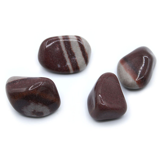A smooth, highly polished Lingam tumble stone featuring natural earthy tones and a pleasing rounded shape.