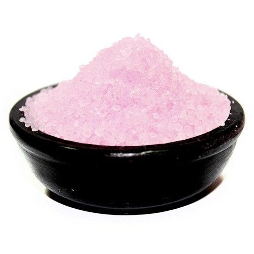 Small white aromatic simmering granules with a sweet vanilla scent in a simple container.