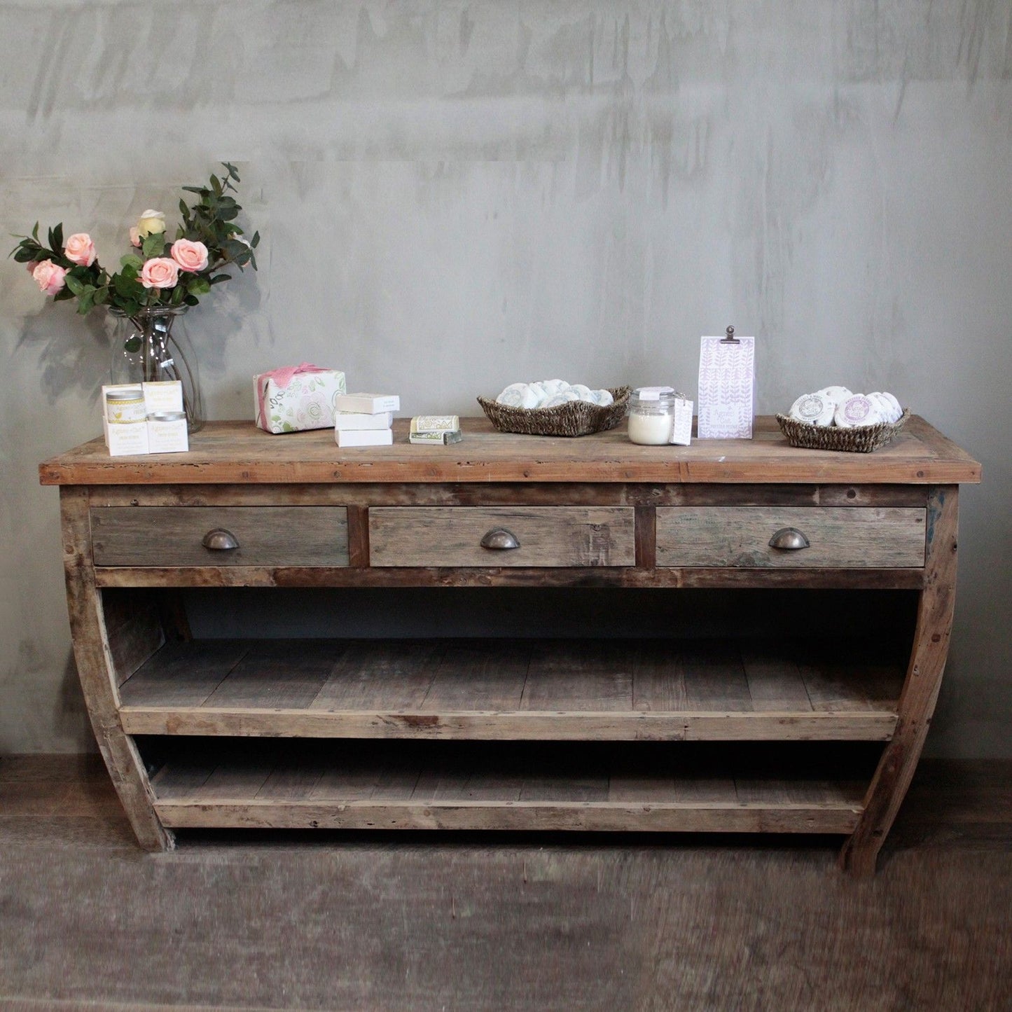 Large hand-made recycled teak wood sideboard table featuring three drawers and two long storage shelves.