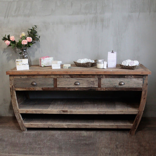 Large hand-made recycled teak wood sideboard table featuring three drawers and two long storage shelves.
