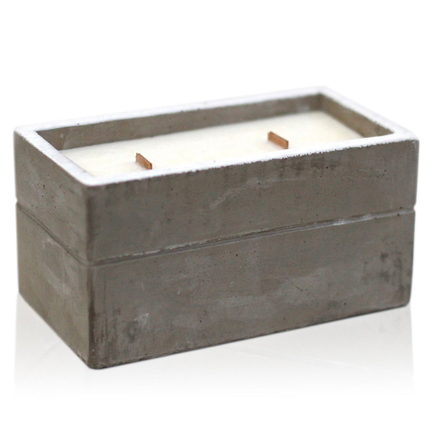 Large grey concrete candle pot with a natural wooden wick and textured raw finish.