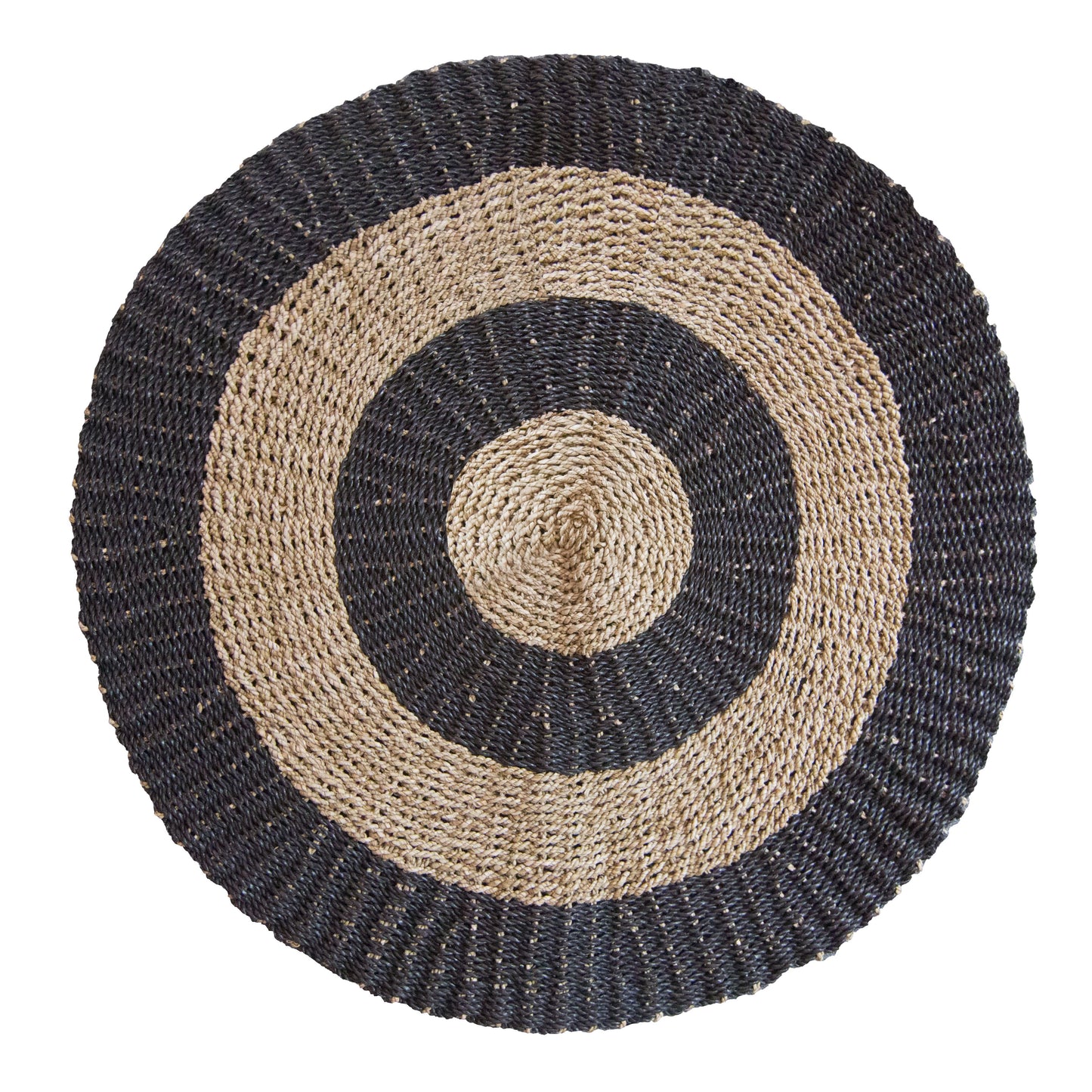 A round 1 metre seagrass rug featuring a natural tan base with a decorative black circular pattern.