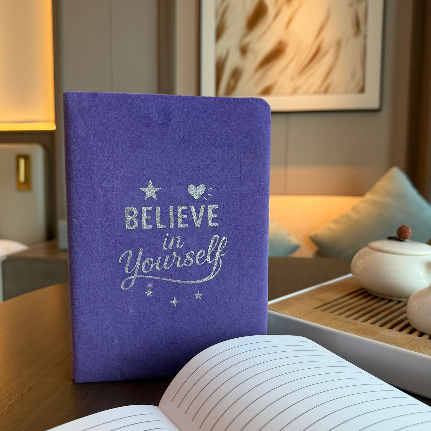 Soft lavender velvet notebook with silver embossed Believe in Yourself text on the front cover.