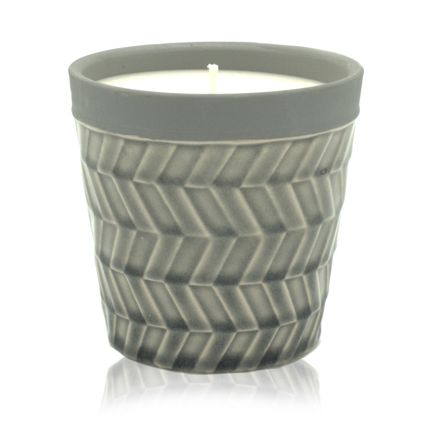 Large cream-coloured ceramic candle pot with a minimalist label and natural soy wax surface.