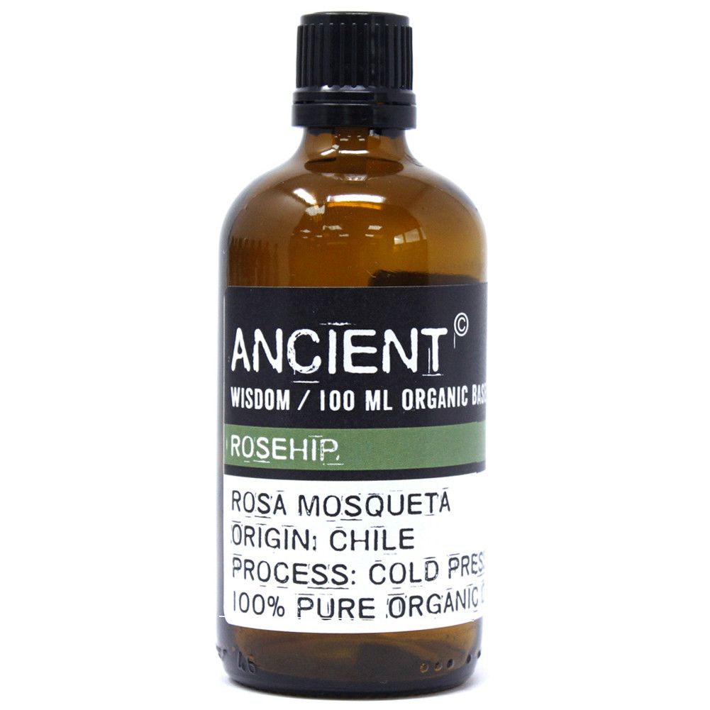 Clear 100ml glass bottle of golden organic rosehip base oil for aromatherapy and skincare.