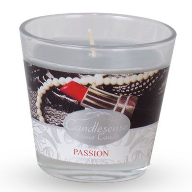 Hand-poured scented candle in a glass jar featuring a minimalist label in a warm home setting.