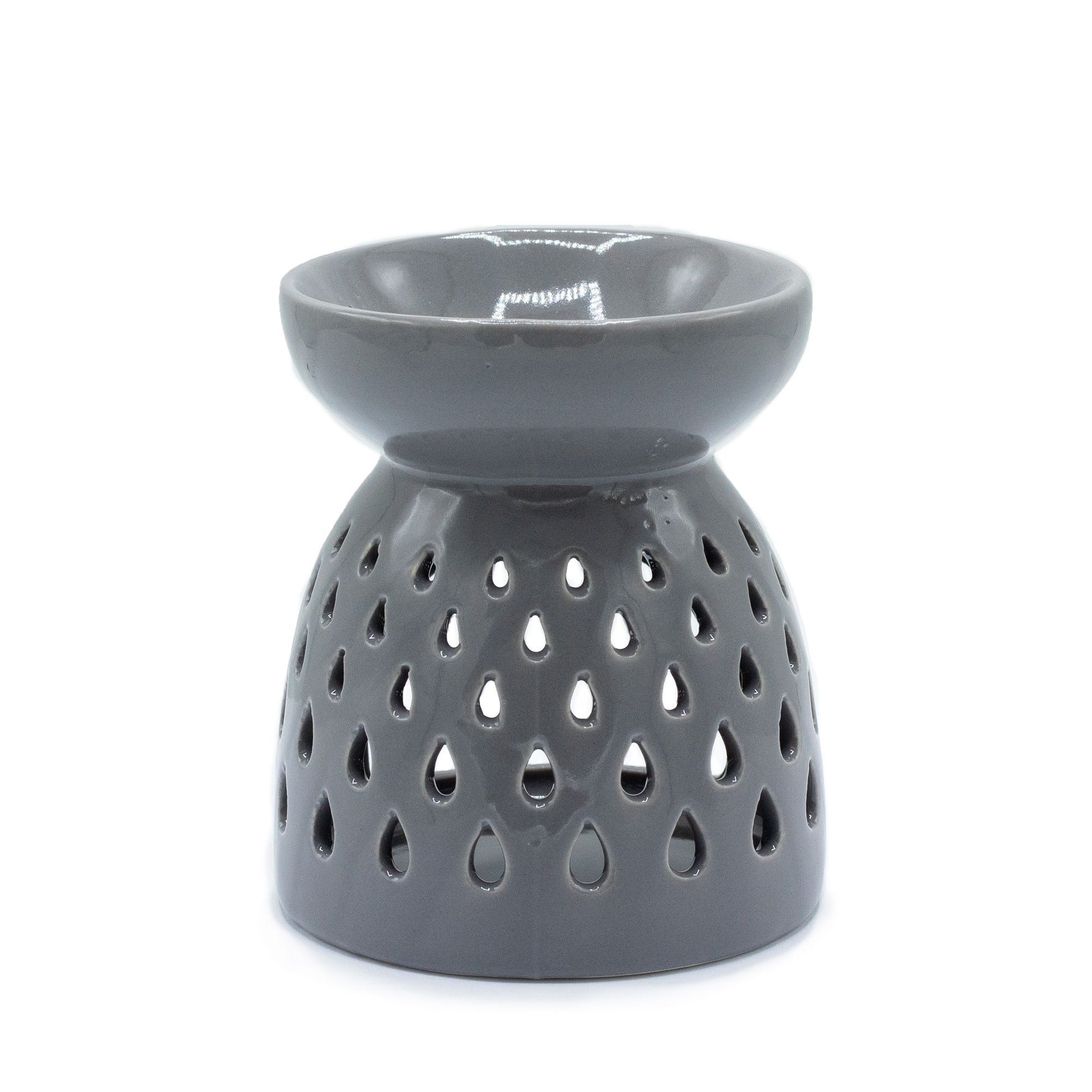 Grey ceramic oil burner with decorative teardrop-shaped cutouts and a gloss finish.