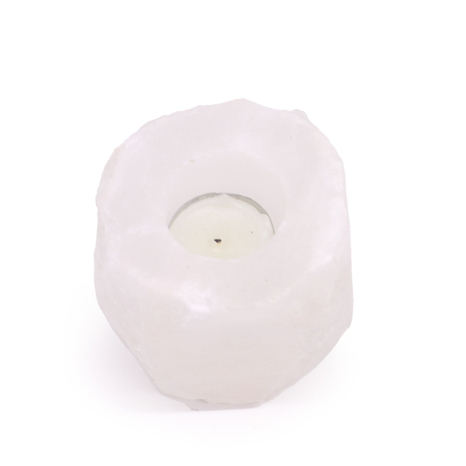 Rough-hewn natural pink Himalayan salt crystal rock candle holder with a carved centre for a tea light.