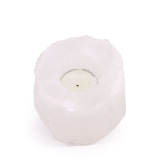 Rough-hewn natural pink Himalayan salt crystal rock candle holder with a carved centre for a tea light.