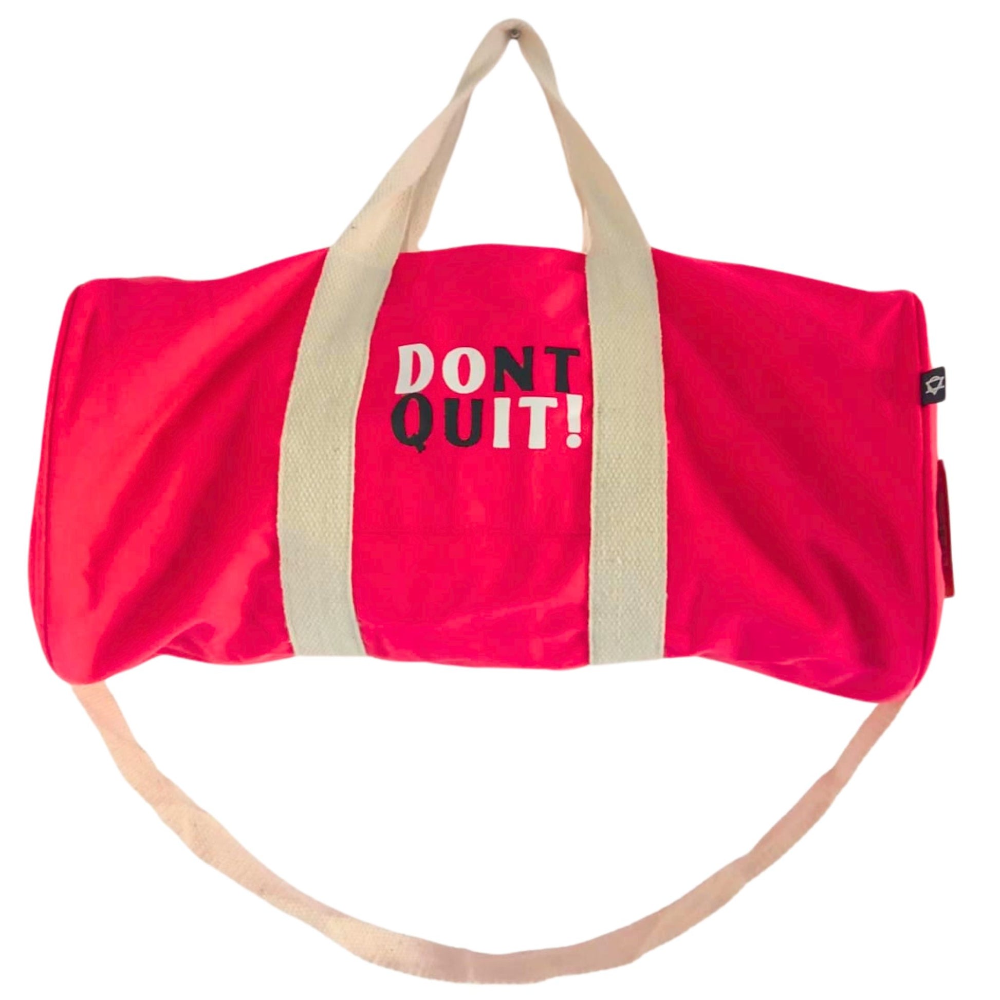 Stylish cherry pink gym bag with the motivational phrase Don't Quit printed on the side.
