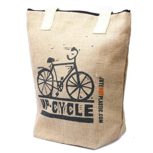 Large eco-friendly jute shopping bag with soft cotton handles and a secure zip closure in a lifestyle setting.