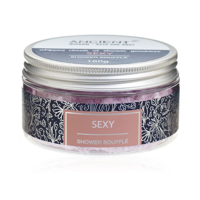 Creamy whipped shower soufflé in a jar, showcasing a light and airy texture for luxurious skin care.