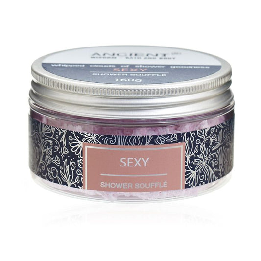 Creamy whipped shower soufflé in a jar, showcasing a light and airy texture for luxurious skin care.