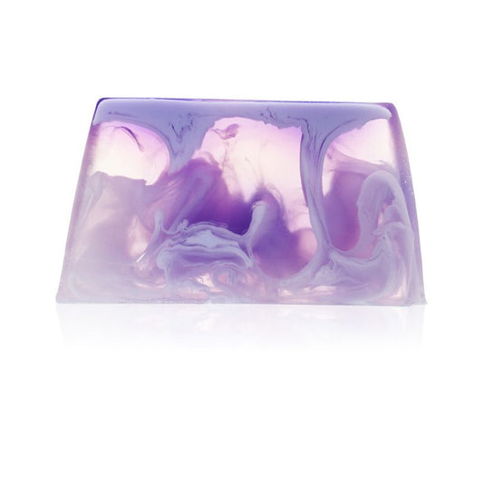 Handcrafted slice of textured shaving soap for men on a neutral background.
