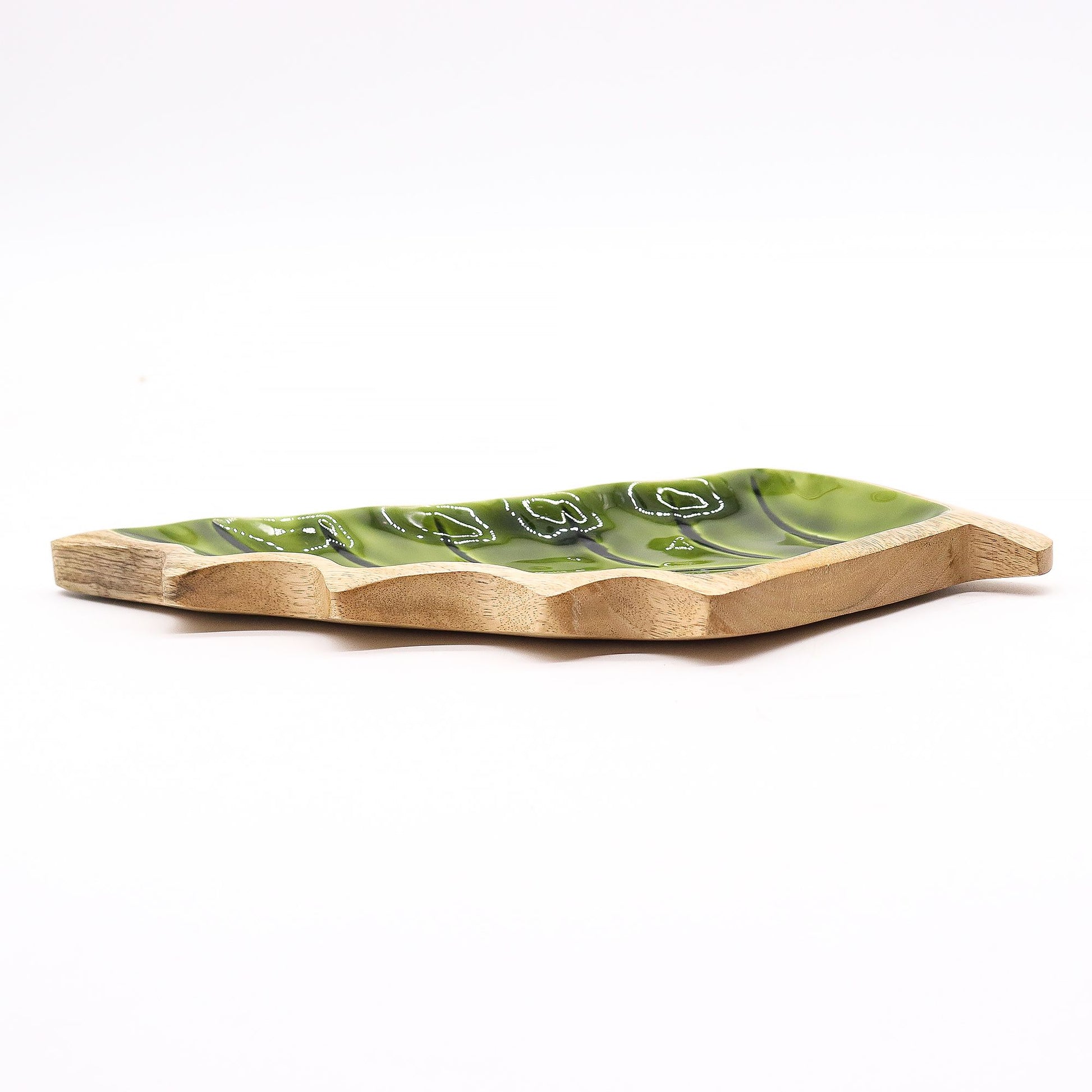 Elegant leaf-shaped bowl made from natural mango wood with a glossy green enamel interior finish.