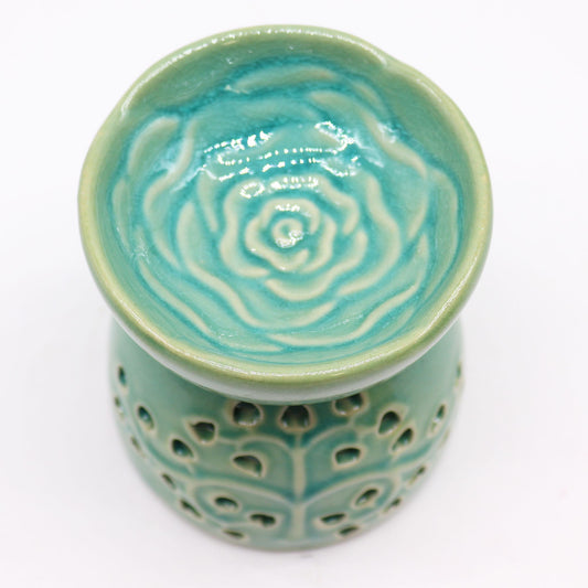 Ceramic oil burner in vibrant blue with a decorative Tree of Life cutout design and glossy finish.