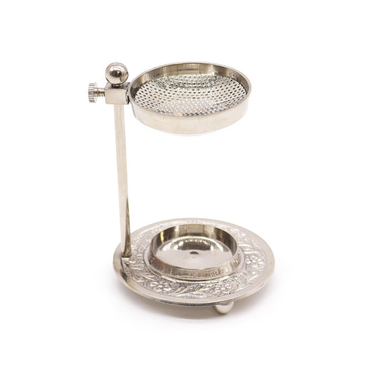 Elegant silver-finish plated brass incense warmer with adjustable height and intricate floral engravings on the base.