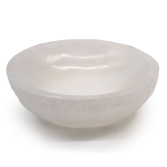Large smooth white selenite crystal bowl with a polished finish and natural translucent glow.