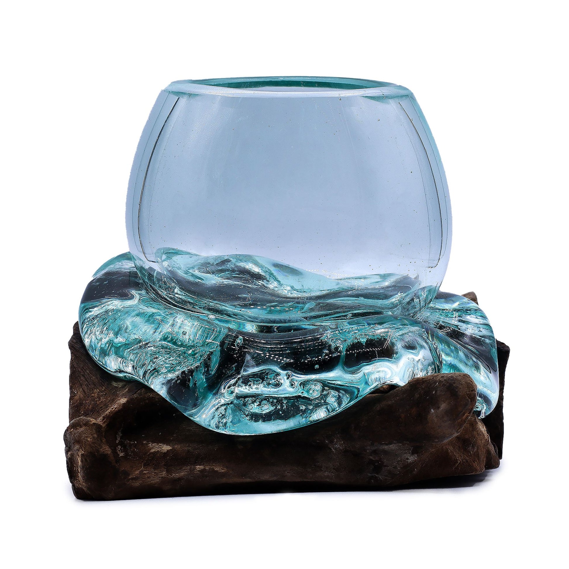 A small hand-blown molten glass bowl beautifully melted over a rustic natural wood base, creating a flowing organic shape.