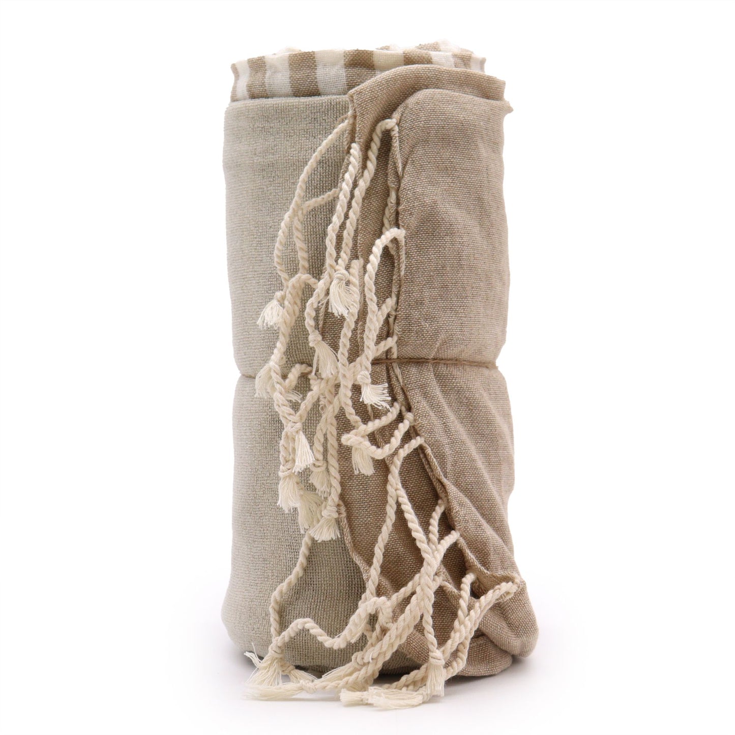 Large cotton pareo towel in a warm sand beige colour with a soft woven texture and fringed edges.
