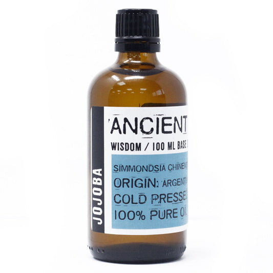 Clear 100ml bottle of golden jojoba oil used as a natural base carrier oil for skin and hair care.