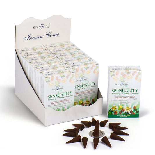 A pile of dark, hand-crafted incense cones ready to release a warm and harmonious fragrance for relaxation.