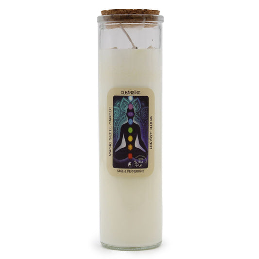 Soy wax candle in a glass jar with white jasper gemstones and dried herbs on top.